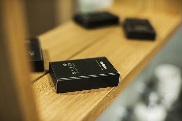 A wooden shelf with black boxes labeled "SEA OF SPA."