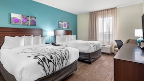 A hotel room with two beds, a desk, a chair, and a window with curtains. - Sleep Inn Lancaster Dallas South (Lancaster)