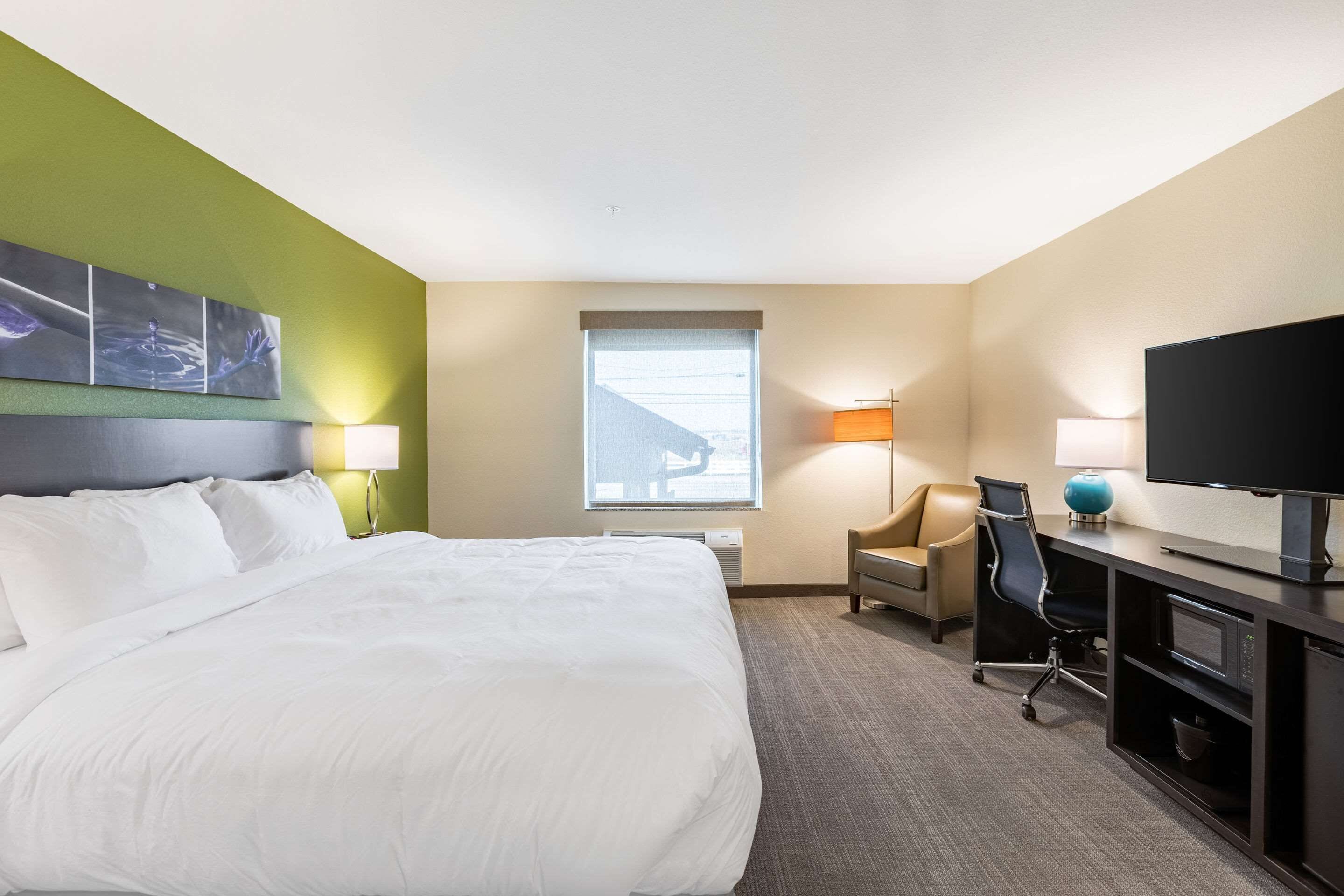 premium bedding, desk, laptop workspace, blackout curtains