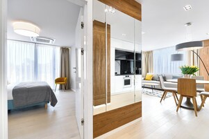 Deluxe Apartment | Living area | Flat-screen TV