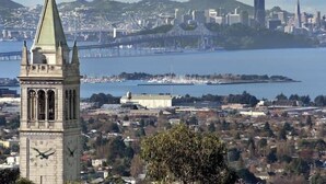 A cityscape with a prominent clock tower, a bridge, and a body of water. - Cosy Berkeley Apartments Just Across UC Berkeley #206 (Berkeley)