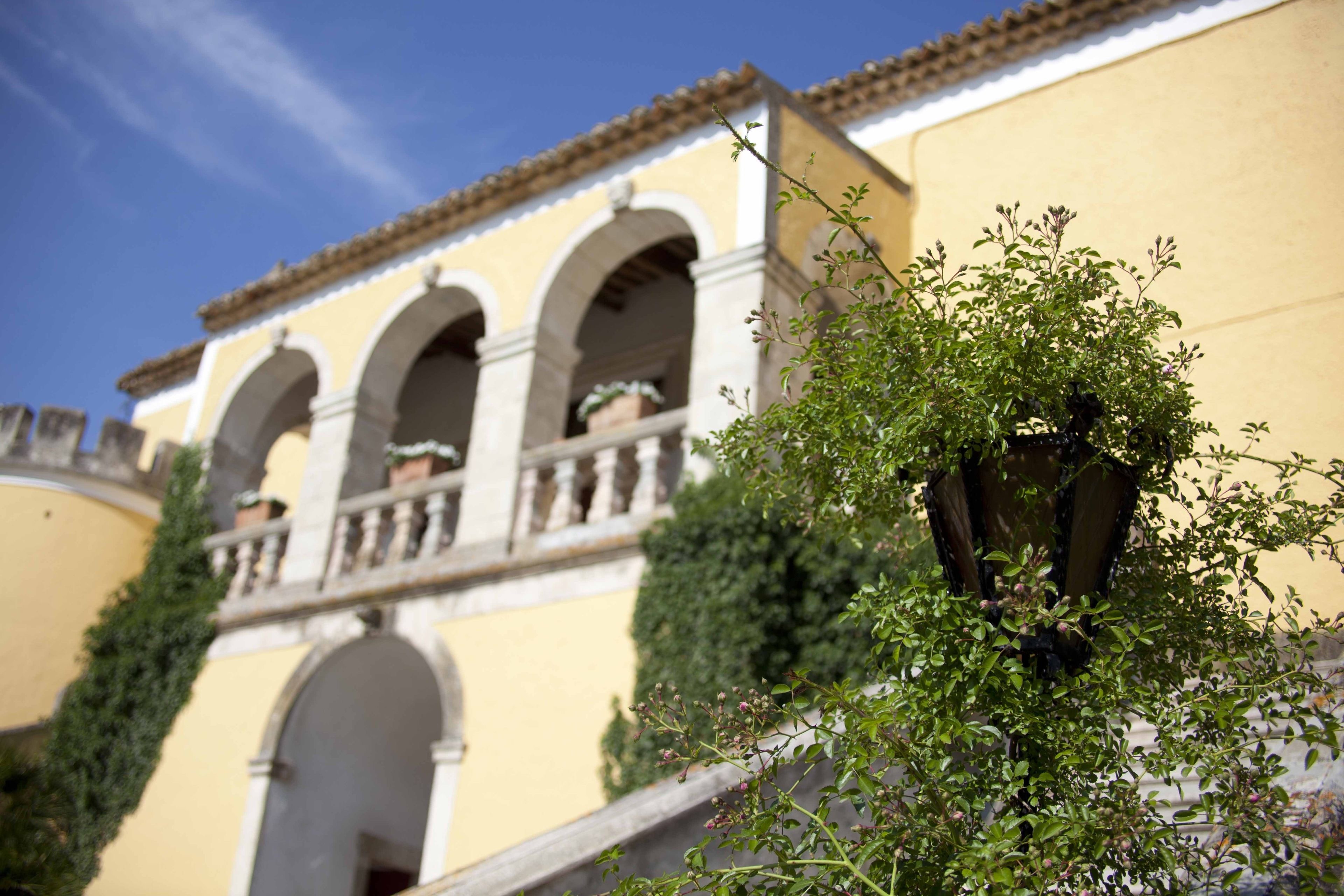 A building with arched windows and a balcony.
