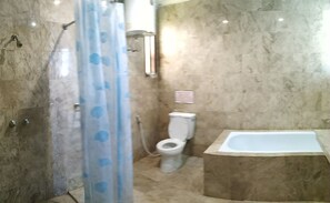 A bathroom with a shower, toilet, and bathtub. - Villa Pinggir Danau Puncak for 30 pax (Cipanas)