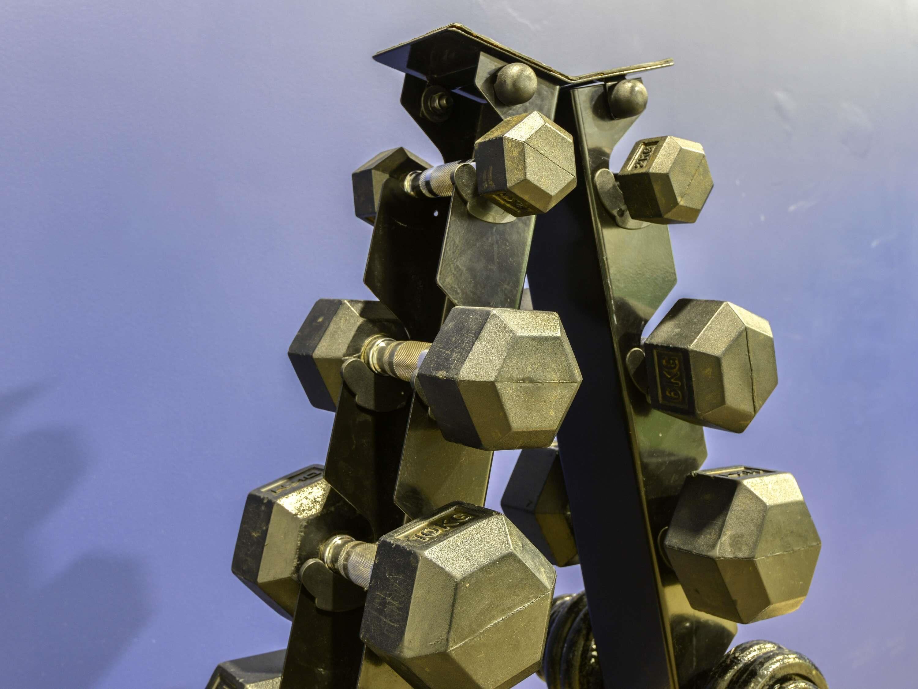 A close-up of a metallic structure with hexagonal shapes and bolts, possibly a piece of modern art or sculpture.