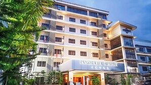 A multi-story hotel with a modern design, featuring balconies and large windows. The name "Panorama Summit Hotel" is visible on the facade. - Panorama Summit Hotel (Davao)