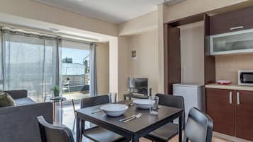 Apartment, 1 Bedroom, City View | Private kitchen | Fridge, microwave, oven, stovetop