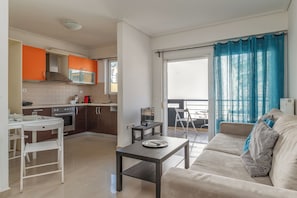 Apartment, 1 Bedroom (4th Floor) | Living area | Flat-screen TV