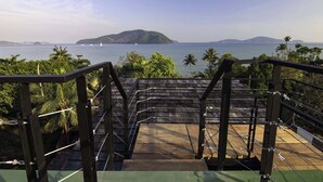 A wooden staircase leading to a balcony overlooking a calm sea with distant islands. - Amazing 5BR Seaview Private Pool Villa by Intira Villas (Rawai)