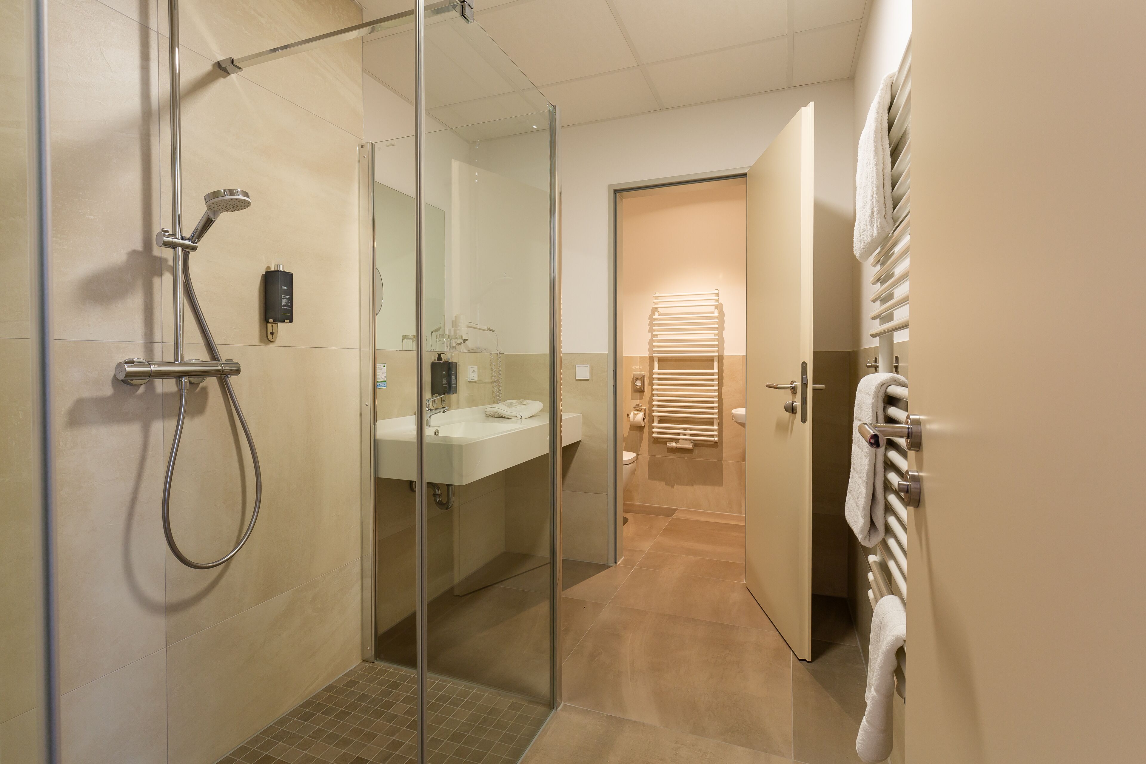 junior room, valley view | bathroom | shower, rainfall showerhead, free toiletries, hair dryer