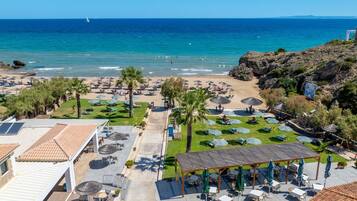 On the beach, sun loungers, beach umbrellas, beach bar