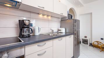 Exclusive Apartment, Sea View (Vista Bay Opatija 3) | Private kitchen | Fridge, microwave, oven, stovetop