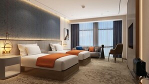 A hotel room with two beds, a sofa, a desk, and a chair. - Jintai Metropark Hotel (Taizhou)