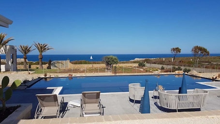 Outdoor pool, open 6:00 AM to midnight, pool umbrellas, pool loungers. Coralli del Plemmirio