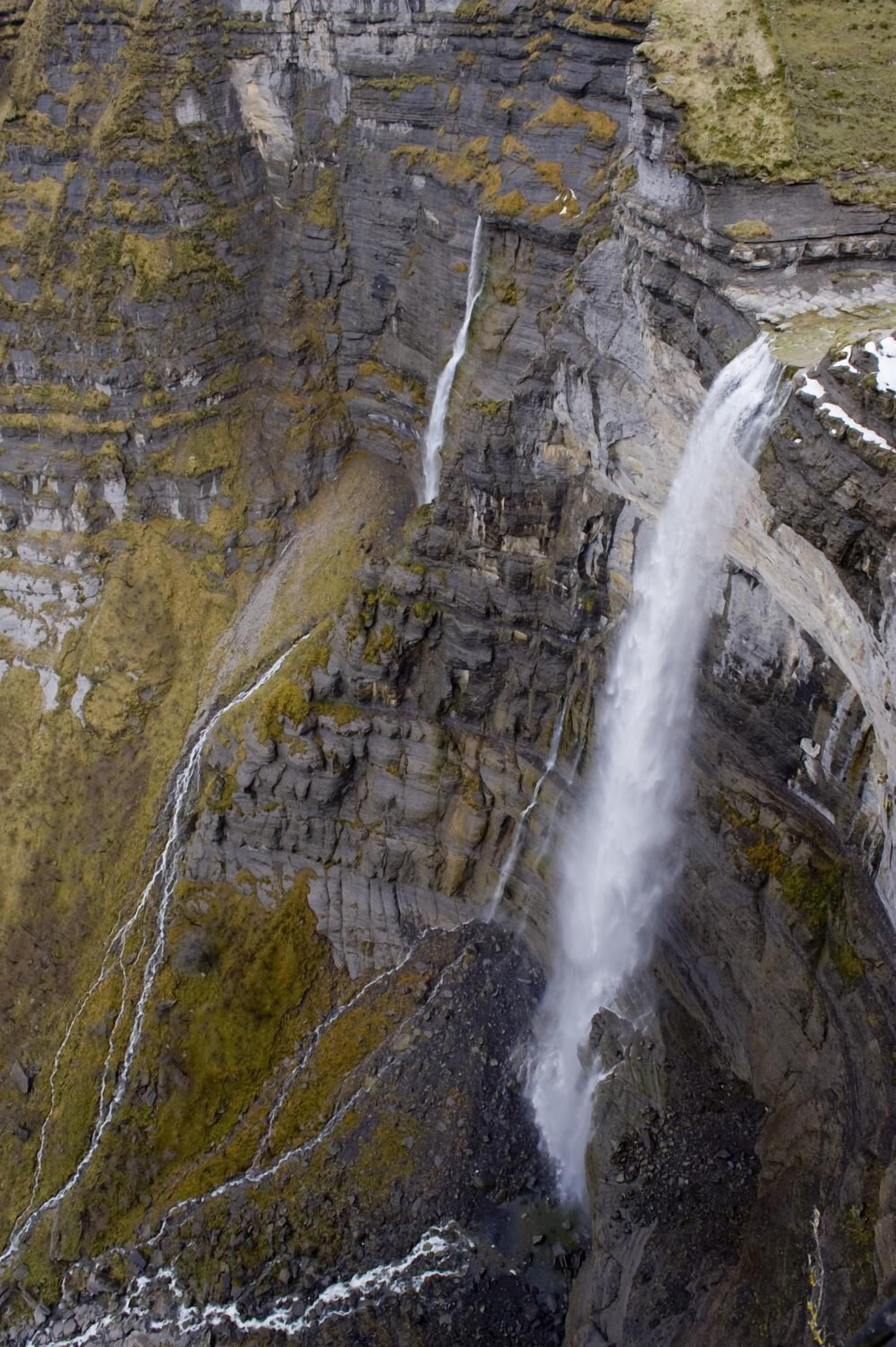 A waterfall cascading down a rocky cliff.
