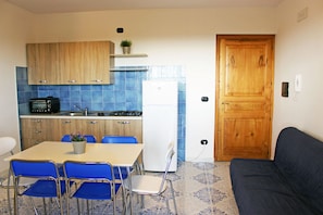 Apartment, 2 Bedrooms, Sea View | Private kitchenette | Full-sized fridge, oven, stovetop, cookware/dishes/utensils