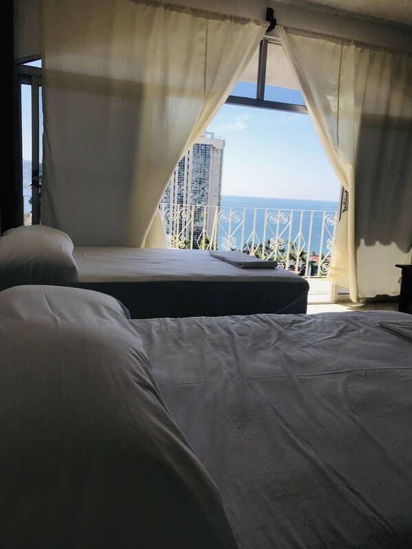 Family Suite, Multiple Beds, Smoking, Bay View | Free WiFi, bed sheets - Hotel Karoline (Acapulco)
