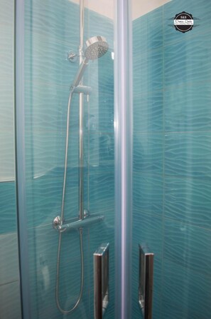 Shower, free toiletries, hair dryer, towels