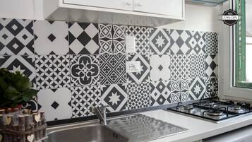 Fridge, stovetop, coffee/tea maker, electric kettle