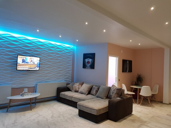 Deluxe Apartment, Non Smoking, Terrace | Living room | 101-cm LCD TV with cable channels, TV