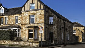 A stone building with multiple windows and a sign indicating no parking except for access to street premises. - Hexham Town Bed and Breakfast (Hexham)