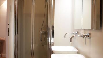 Exclusive Double Room, City View | Bathroom | Shower, rainfall showerhead, designer toiletries, hair dryer