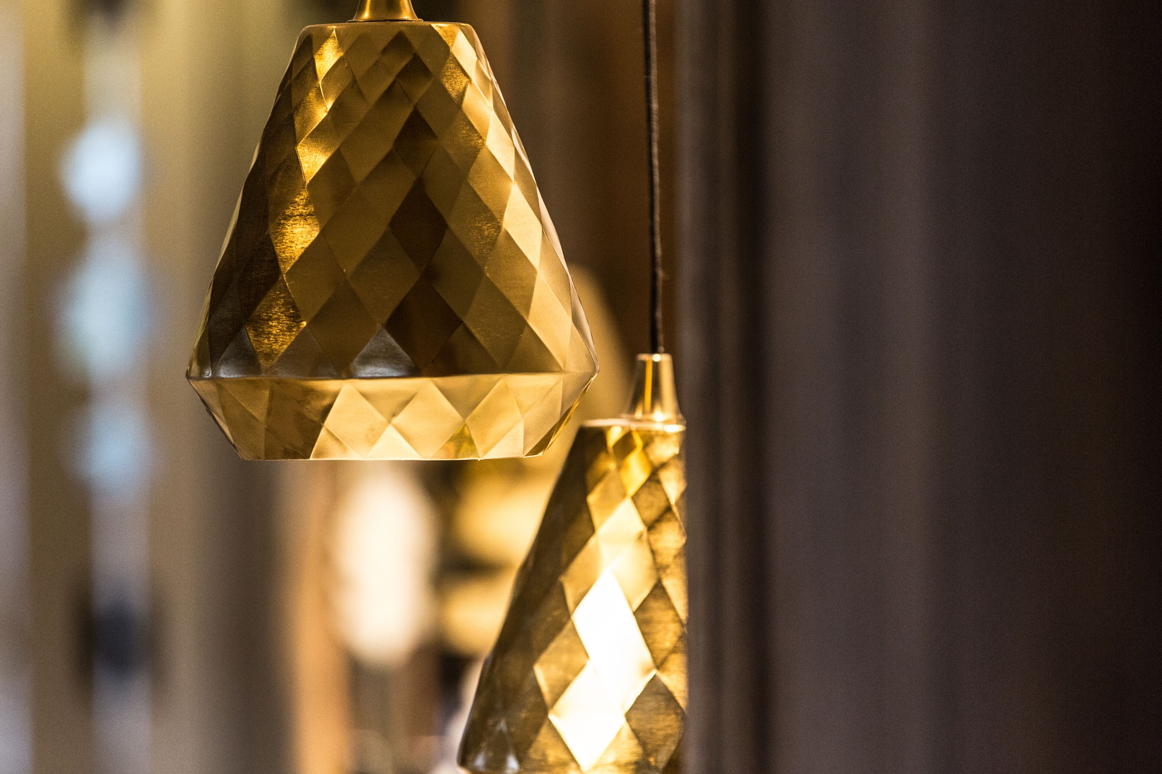 A close-up of a geometric patterned pendant light fixture.