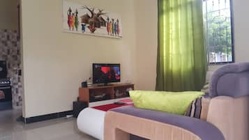 Classic House, Non Smoking | Living area | Flat-screen TV