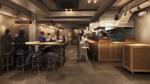A modern restaurant with high ceilings, exposed ductwork, and a mix of bar stools and tables. - UNPLAN Shinjuku – Hostel (Tokyo)