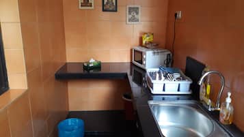 Full-size fridge, microwave, stovetop, coffee/tea maker