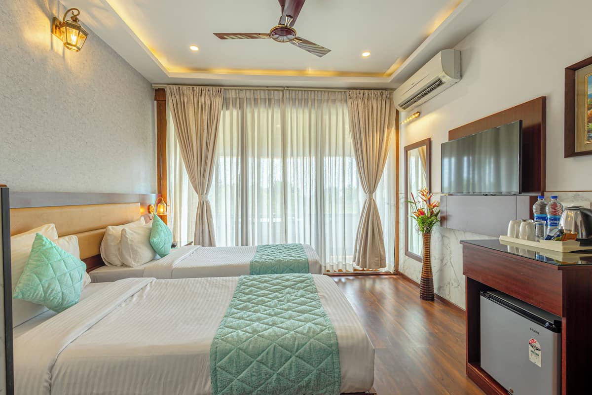 Chambre Premium, 1 chambre, vue jardin | Literie de qualité supérieure, coffres-forts dans les chambres