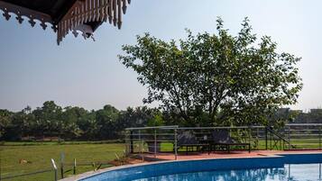 Outdoor pool, open 7:30 AM to 6:00 PM, pool umbrellas