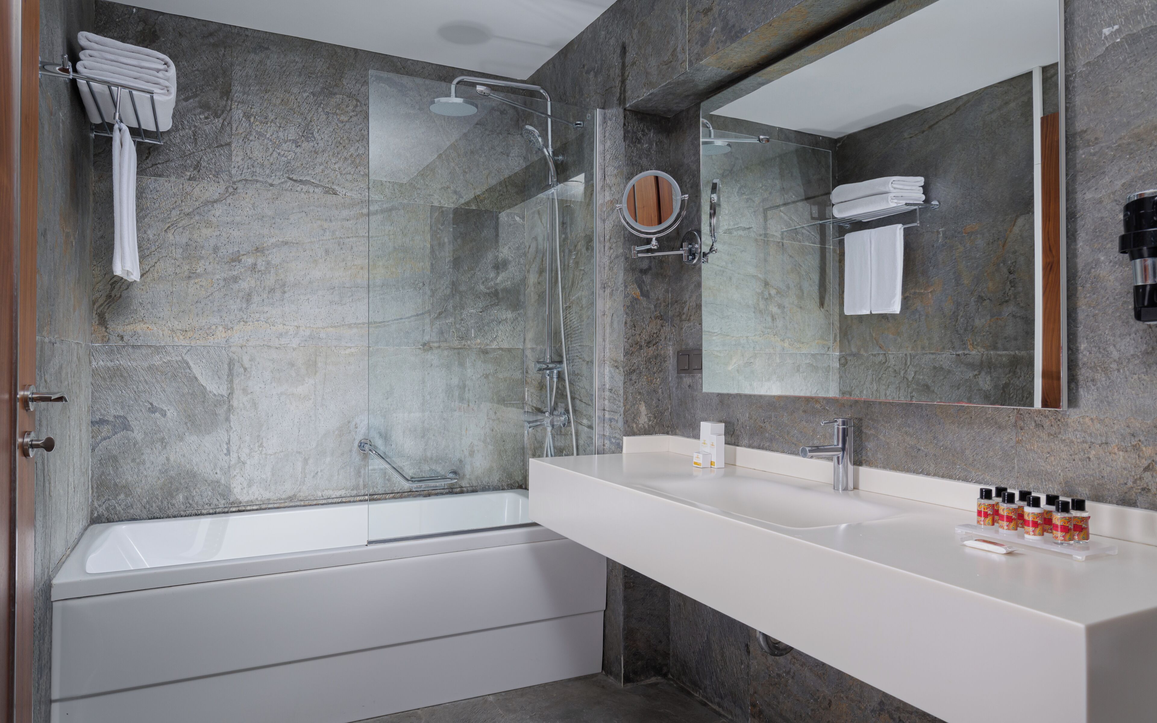 deep-soaking bathtub, rainfall showerhead, designer toiletries