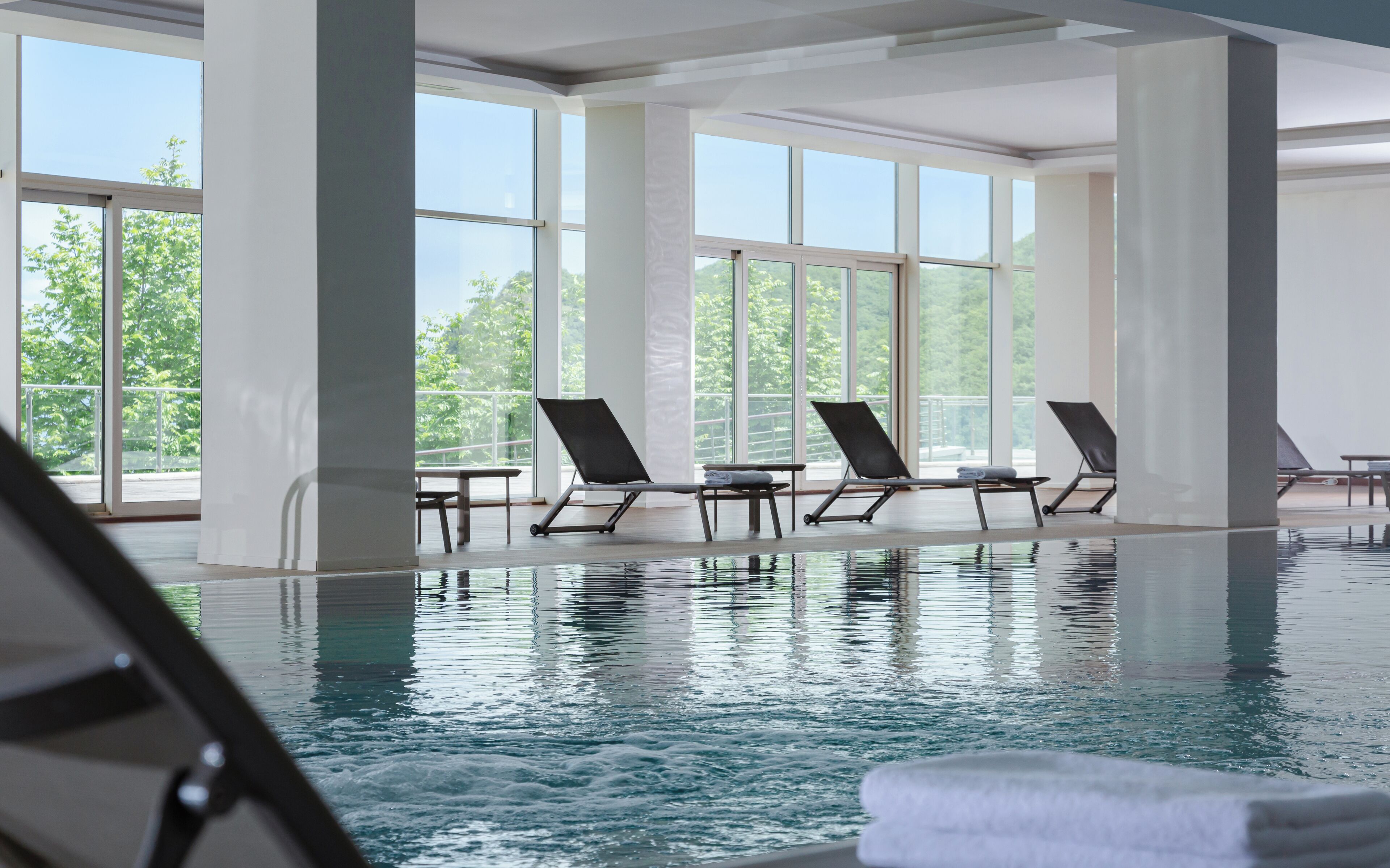 indoor pool, seasonal outdoor pool, pool loungers