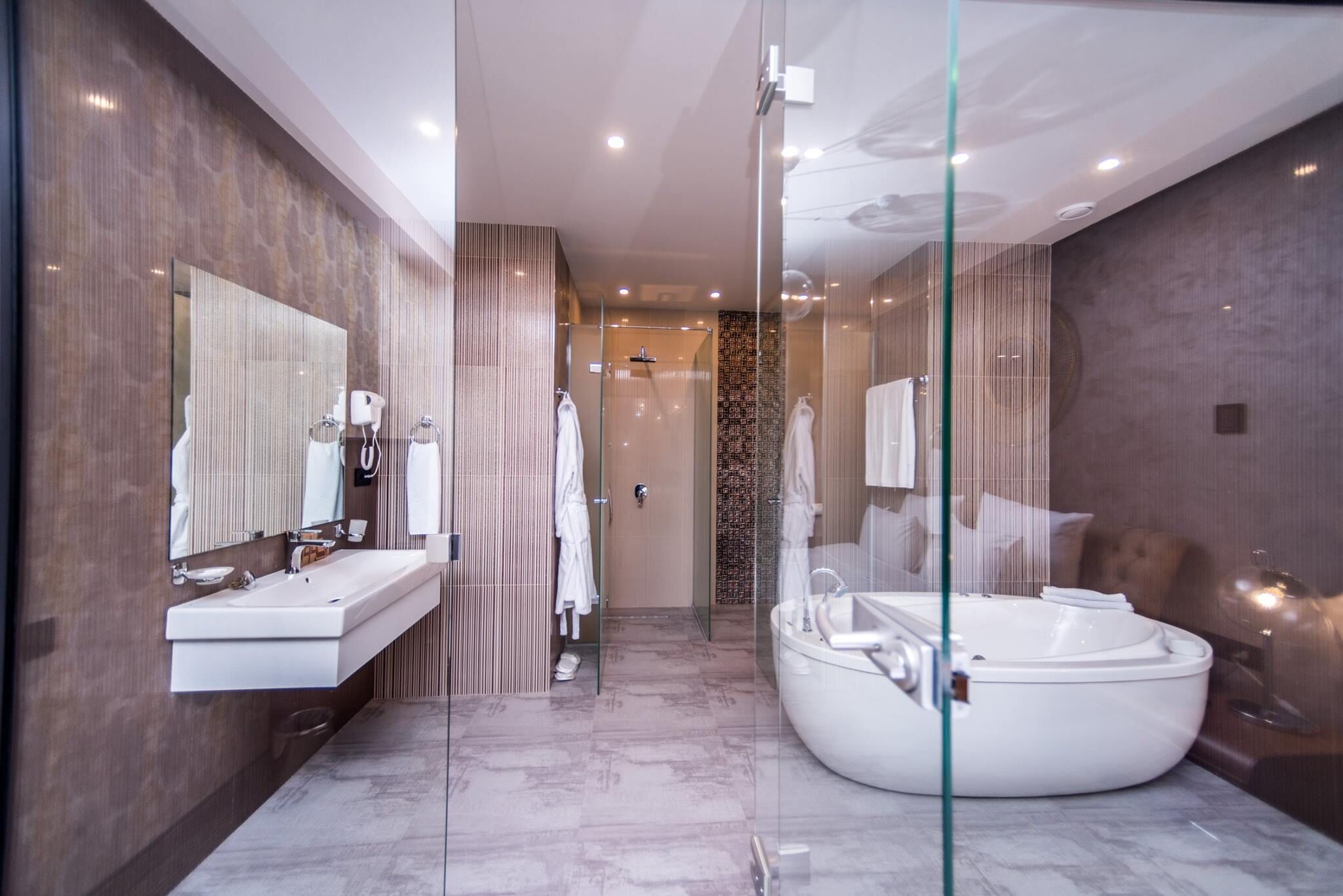 family suite, 2 bedrooms | bathroom | separate bathtub and shower, deep-soaking bathtub, rainfall showerhead