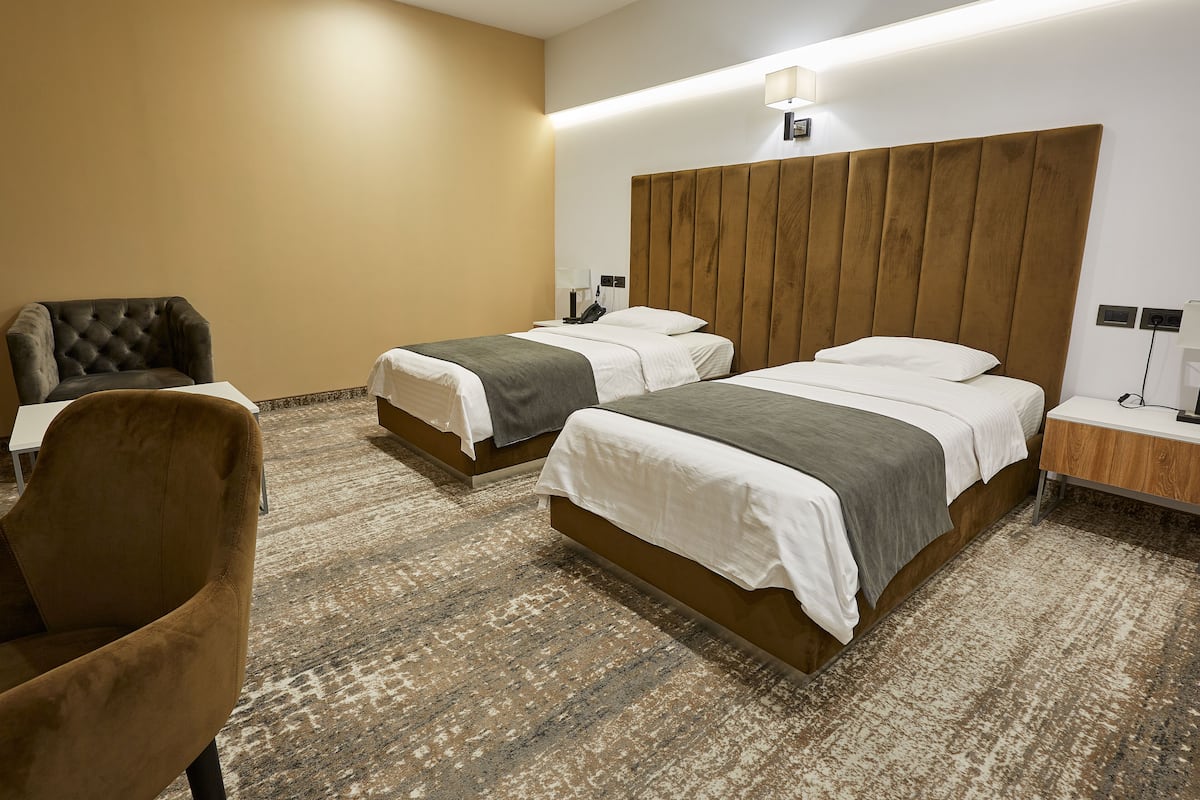 Economy Twin kamer, niet-roken, geen ramen | Luxe beddengoed, een minibar, een kluis op de kamer