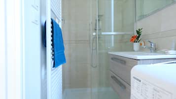 Apartment, 1 Bedroom | Bathroom | Shower, rainfall showerhead, hair dryer, bidet