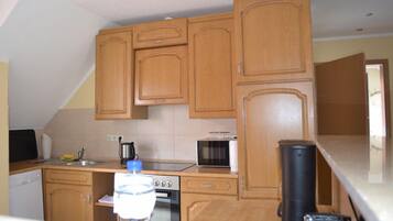 Apartment | Private kitchen | Full-sized fridge, microwave, oven, stovetop