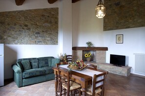 Full-sized fridge, stovetop, cookware/dishes/utensils