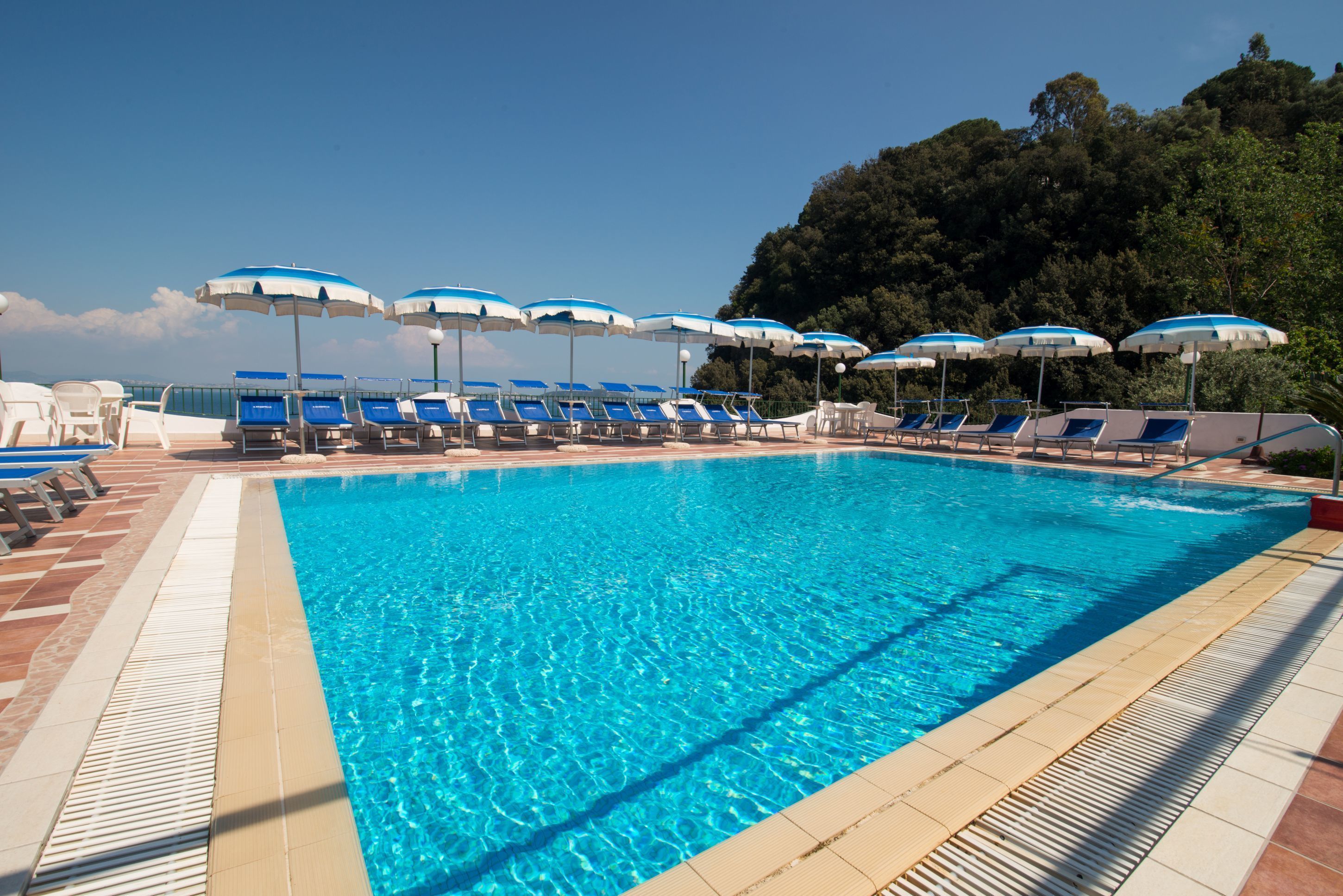 outdoor pool, pool umbrellas, pool loungers