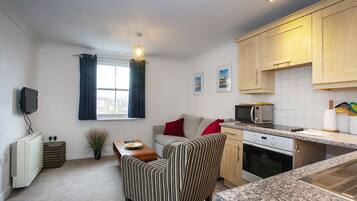 Apartment, 1 Double Bed with Sofa bed, Non Smoking | Living area | Flat-screen TV