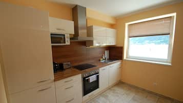 Leilighet (Penthouse A Zell am See) | Eget kjøkken | Kjøleskap, mikrobølgeovn, ovn og kokeplater