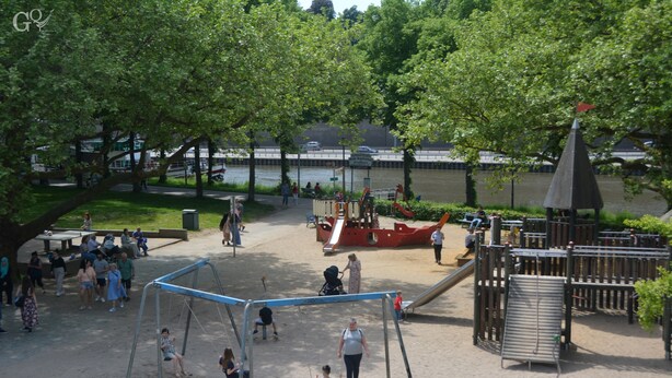 A playground with swings, slides, and climbing structures. - Saarbrücken City Apartments (Saarbrücken)