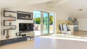 Villa | Living area | Flat-screen TV, DVD player