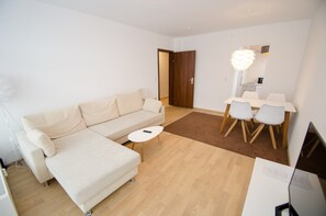 Apartment, 2 Bedrooms, Balcony (CityXpress Ski in/Ski out) | Living room | Flat-screen TV - Apartment CityXpress (Zell am See)