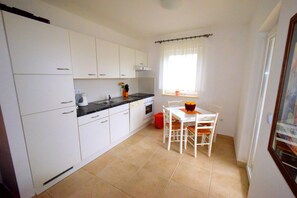 Apartment, 2 Bedrooms (610 - Vanja) | Private kitchen | Fridge, oven, stovetop, cookware/dishes/utensils - Apartments Ravlic (Punat)