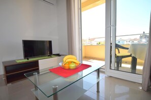 Apartment, Balcony | Living area | Flat-screen TV