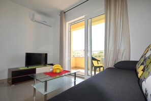 Apartment, Balcony | Living area | Flat-screen TV