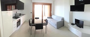Superior Apartment, 2 Bedrooms, Accessible, Lagoon View | Living area | LED TV, DVD player - ApartHotel Capitol (Grado)