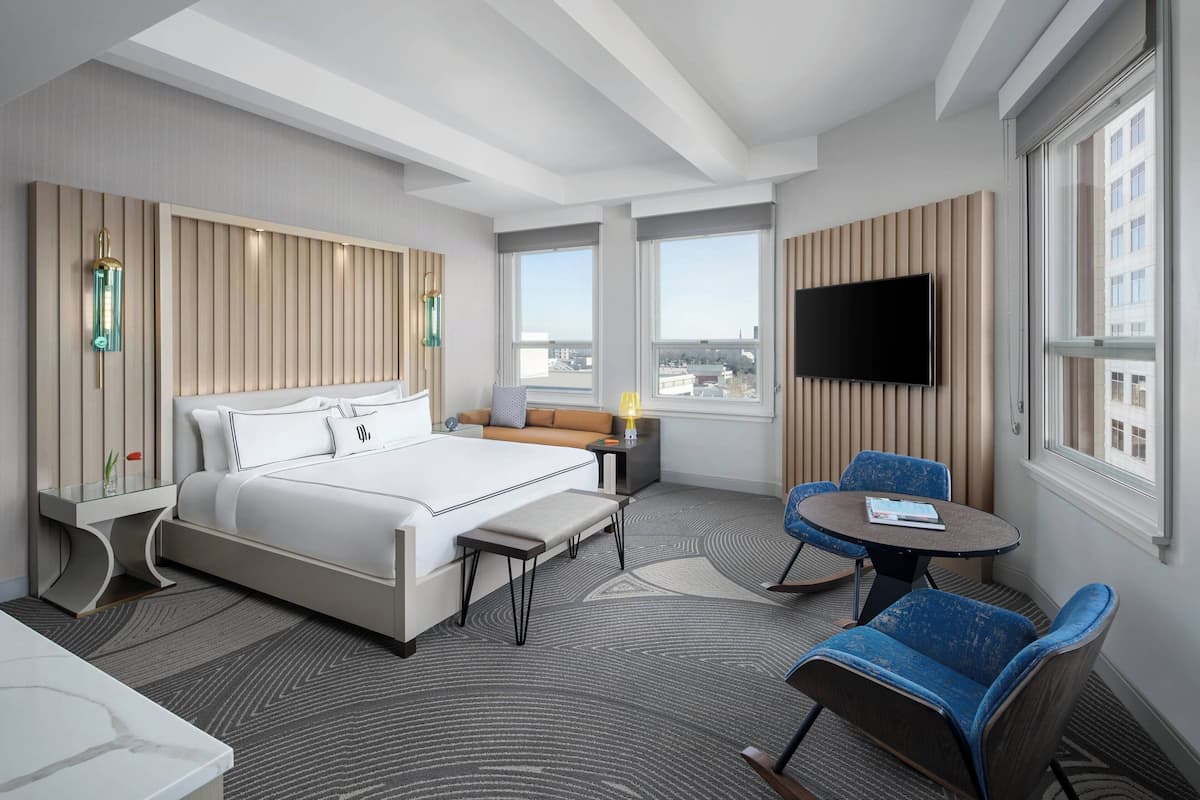 deluxe room, 1 king bed, city view, corner | premium bedding, in-room safe, desk, blackout curtains