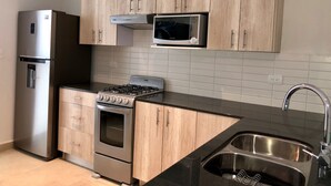 Premium-Apartment, Mehrere Betten, barrierefrei, Gartenblick | Eigene Küche